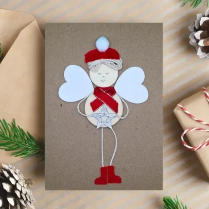 Adorable Family Festive Greeting Card with Angel boy made of wood on brown paper, from the UK.