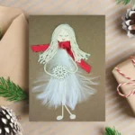 Adorable Handmade Christmas Card For Her, for wife, grandpa, daughter or granddaughter with Angel made of white feathers.