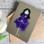 Astonish Personalised Unique Birthday Card for Wife made of purple feathers on brown paper.