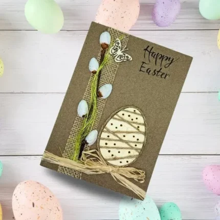 This is a unique handmade Beautiful Egg Easter Card card featuring a painted wooden egg, along with catkins and a butterfly.