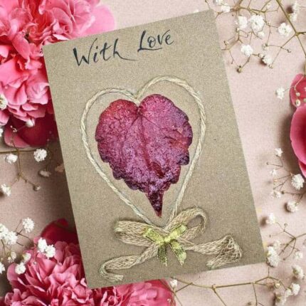 Beautiful Handmade Valentine's Card: A red leaf heart with twine border, "With Love" text, surrounded by pink flowers and baby's breath.