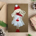 Beautiful Homemade Christmas Card with showgirl made of white feathers.