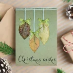 Best Handmae Merry Christmas card for Someone Special made of three dry leaves and festive text below.