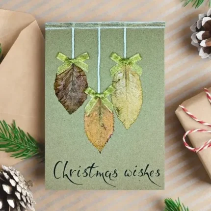 Best Handmae Merry Christmas card for Someone Special made of three dry leaves and festive text below.