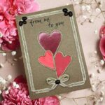 Personalised Handmade Valentine's Card with three leaves in the shape of a heart, a cotton string tied in a corner.