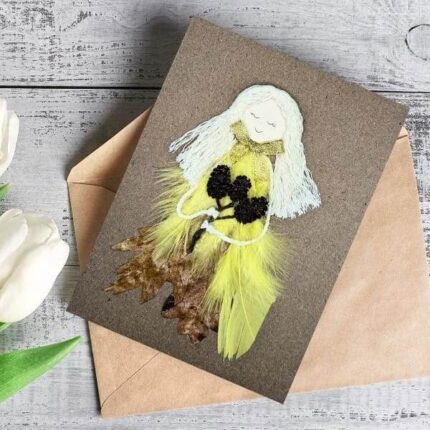 Enchanted Handmade with Love Card for Her made of dry leaf, yellow bright feathers, cotton string and small cones.