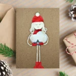 Handmade and Personalised Merry Christmas card with showgirl made of white seashell.