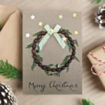 Handmade Wreath Christmas Card idea with bead wreath made of coffee beans, green foliage, and white bow.