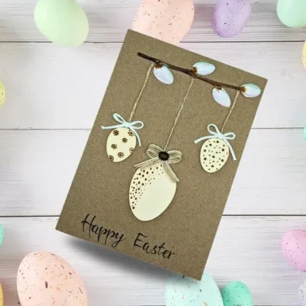 Handmade Happy Easter Card with Cute Three Colourful Eggs Decoration made of wood.