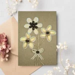 Handmade thank you card for mum or dad with yarn and fabric details depicting a girl jumping rope, set against a brown cardstock background. Includes a red paper heart and a kraft paper envelope.