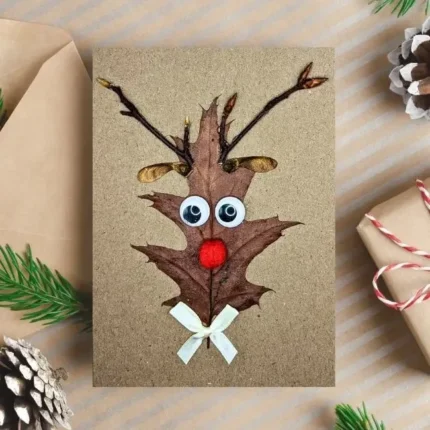 Hilarious Reindeer Christmas Card - handmade from leaves and a wooden stick, with a red nose reindeer design.