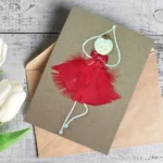 Personalised handmade greeting card for Her birthday or other occasions with a red ballerina in a red feathers.