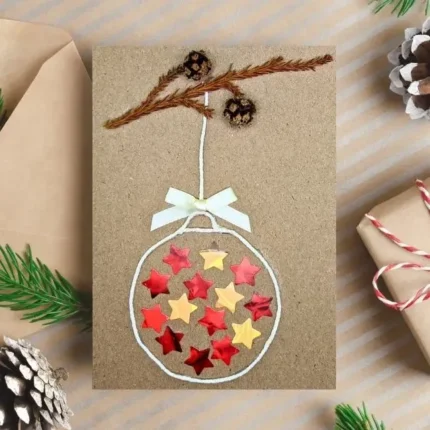 Handmade Christmas Ornament Ball Card is made from recycled cardboard and features a festive ball on a tree branch.