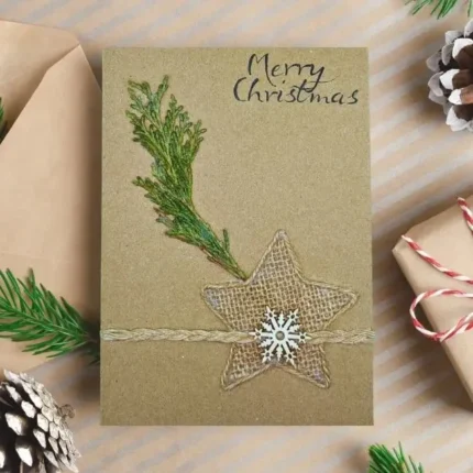 Unique Handmade Christmas card featuring pine cones and a star design, perfect for holiday greetings.