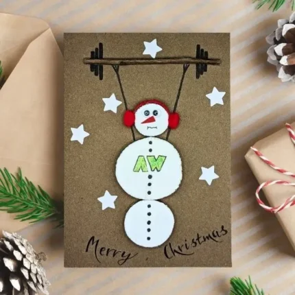 Unique Handmade Christmas card for fitness instructor with a snowman lifting barbells.