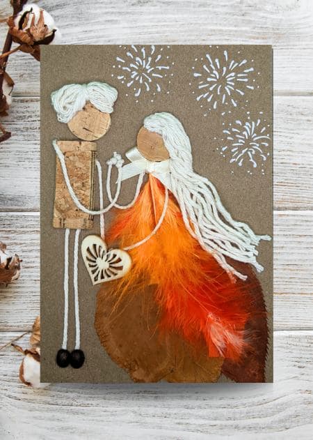 A handmade anniversary card depicting a couple holding hands with a feather, representing love and togetherness, part of a collection banner.