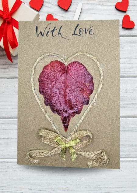 A Valentine’s Day card displaying a heart-shaped leaf is part of a collection of handmade Valentine’s Day cards celebrating love.