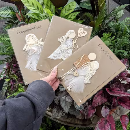 Three handmade cards featuring a woman holding a bird and another bird perched on a branch, perfect for her.